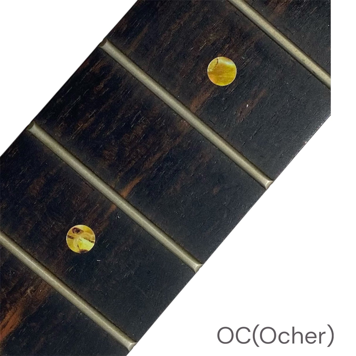 Close-up of a guitar fretboard with ocher dot inlay stickers
