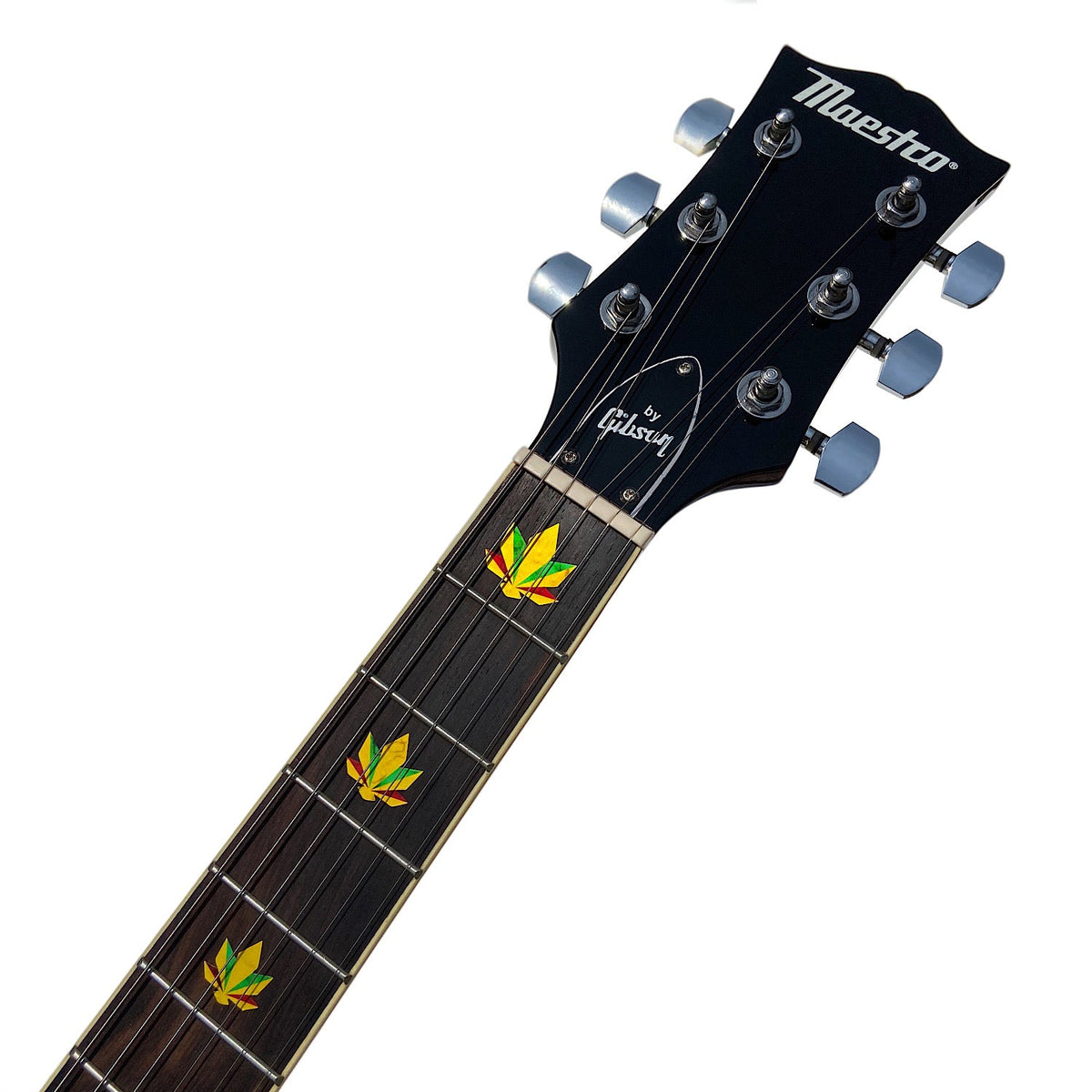 Rasta Color Cannabis Leaf Inlay Stickers applied on a Rosewood fretboard